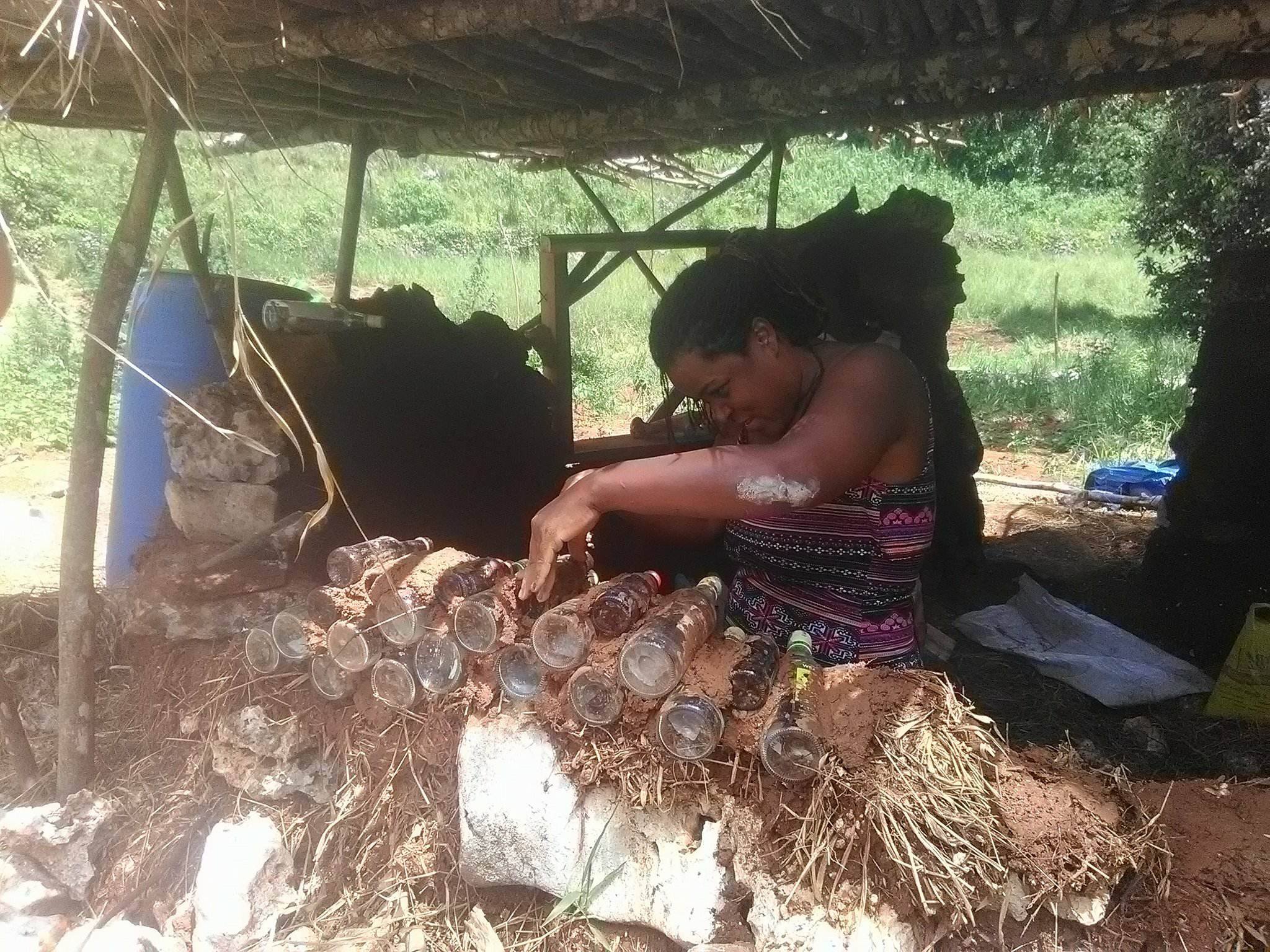 Adjusting the Bottles of the Cob Bottle Wall