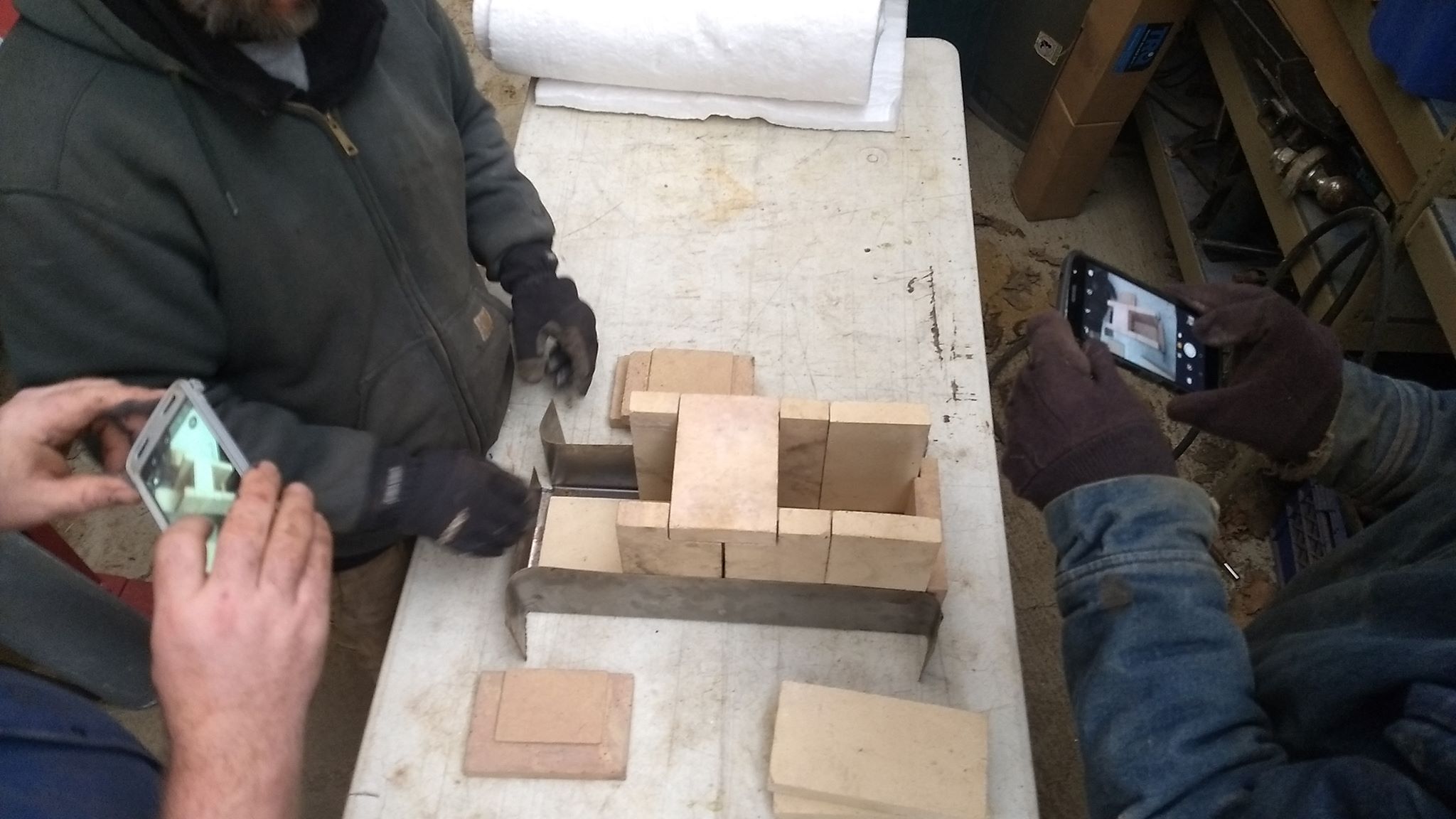 Positioning the bricks for the burn chamber